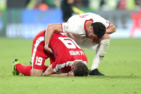 Cầu thủ Palestine (áo đỏ) đã khóc khi trận đấu kết thúc. (Nguồn: Reuters)