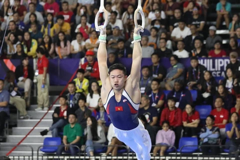 Đặng Nam giành huy chương Vàng đầu tiên cho đội tuyển Thể dục dụng cụ tại SEA Games 30. (Ảnh: Vietnam+)
