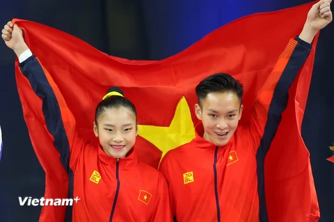 Phan Thế Gia Hiển-Bùi Minh Phương giúp Aerobic lập hat-trick huy chương Vàng. (Ảnh: Vietnam+)