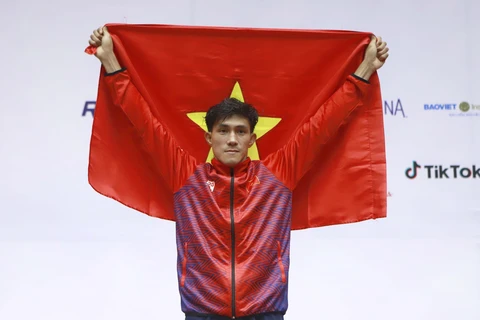 Nguyễn Trần Duy Nhất giành HCV SEA Games hạng cân 60kg. (Ảnh: Hoàng Hùng/TTXVN)