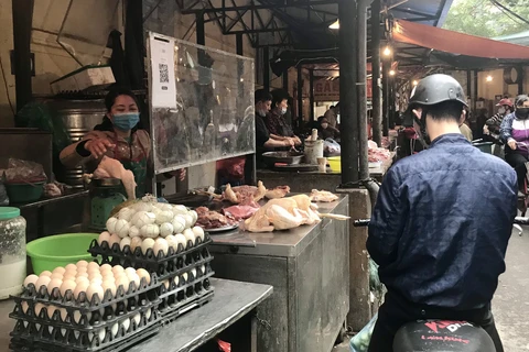 Giá các mặt hàng thực phẩm ở các chợ dân sinh tại Hà Nội tăng cao những ngày cuối năm do nhu cầu của người tiêu dùng (Ảnh: Việt Anh/Vietnam+)