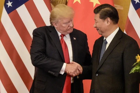 Tổng thống Mỹ Donald Trump và Chủ tịch Trung Quốc Tập Cận Bình trong cuộc gặp tại Bắc Kinh hồi năm 2017. (Ảnh: AFP/ TTXVN) 