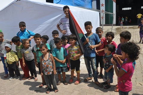 Trẻ em tại trại tị nạn Yarmouk của người Palestine. (Ảnh: Anadolu)