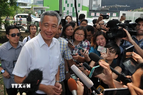 Theo kết quả kiểm phiếu mẫu, đảng PAP của Thủ tướng Lý Hiển Long đủ điều kiện thành lập chính phủ mới. (Ảnh: AFP/TTXVN)