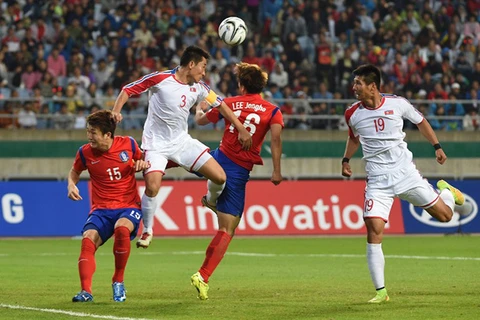 Đội tuyển bóng đá Hàn Quốc và Triều Tiên trong trận chung kết Asiad 2014. (Ảnh: AFP)