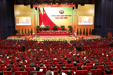Tổng Bí thư, Chủ tịch nước Nguyễn Phú Trọng đọc Báo cáo chính trị của Ban Chấp hành Trung ương Đảng khóa XII và các văn kiện trình Đại hội. (Ảnh: TTXVN)
