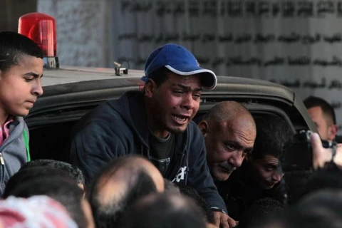 Phản ứng của người thân nạn nhân Mohammed Mubarak. (Ảnh: AFP)