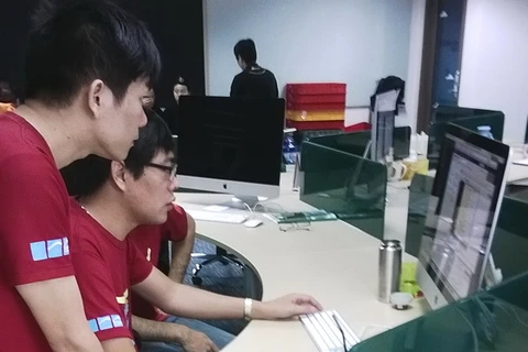Các kỹ sư Việt Nam làm việc tại Trung tâm phát triển phần mềm của Atlassian. (Ảnh: Trần Tình/Vietnam+)