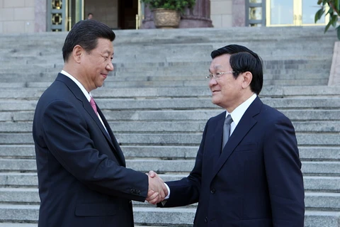 Tổng Bí thư, Chủ tịch nước CHND Trung Hoa Tập Cận Bình đón Chủ tịch nước Trương Tấn Sang trong chuyến thăng Trung Quốc của Chủ tịch nước tháng 6/2013 (Ảnh: Nguyễn khang - TTXVN)