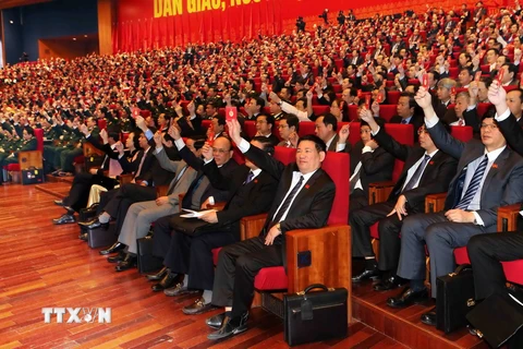 Các đại biểu biểu quyết thông qua Chương trình Đại hội. (Nguồn: TTXVN)