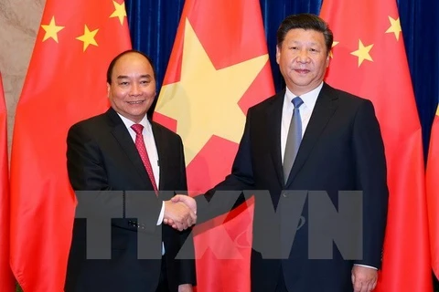 Thủ tướng Nguyễn Xuân Phúc hội kiến với Tổng Bí thư, Chủ tịch nước Trung Quốc Tập Cận Bình. (Ảnh: Thống Nhất/TTXVN)