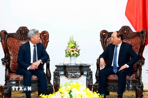 Thủ tướng Nguyễn Xuân Phúc tiếp ông Kim Lập Quần, Chủ tịch Ngân hàng Đầu tư Cơ sở hạ tầng châu Á (AIIB). (Ảnh: Thống Nhất/TTXVN)