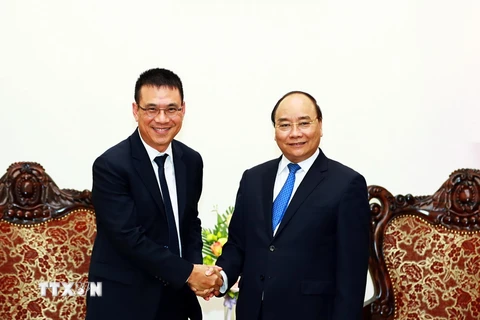 Thủ tướng Nguyễn Xuân Phúc tiếp ông Roongrote Rangsiyopash, Chủ tịch kiêm Tổng Giám đốc điều hành Tập đoàn SCG. (Ảnh: Thống Nhất/TTXVN)