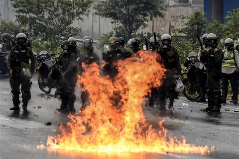 Lực lượng an ninh được triển khai tại khu vực có người biểu tình ở Venezuela. (Nguồn: AFP)