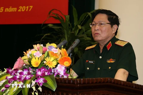 Đại tướng Ngô Xuân Lịch, Ủy viên Bộ Chính trị, Phó Bí thư Quân ủy Trung ương, Bộ trưởng Bộ Quốc phòng chủ trì Hội thảo. (Nguồn: TTXVN)