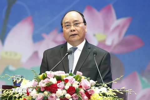 Thủ tướng Nguyễn Xuân Phúc chủ trì Hội nghị Thủ tướng Chính phủ với doanh nghiệp 'Đồng hành cùng doanh nghiệp' năm 2017. (Ảnh: Thống Nhất/TTXVN)