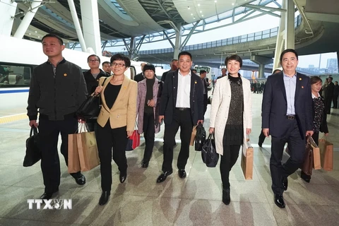 Các đại biểu của tỉnh An Huy tới thủ đô Bắc Kinh tham dự Đại hội, ngày 15/10. (Nguồn: THX/TTXVN)
