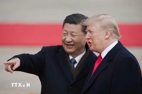  Chủ tịch Trung Quốc Tập Cận Bình (trái) và Tổng thống Mỹ Donald Trump tại lễ đón ở Bắc Kinh ngày 9/11. (Nguồn: AFP/TTXVN)