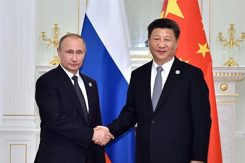 Chủ tịch Trung Quốc Tập Cận Bình (phải) và Tổng thống Nga Vladimir Putin trong một cuộc gặp. (Nguồn: Xinhuanet)