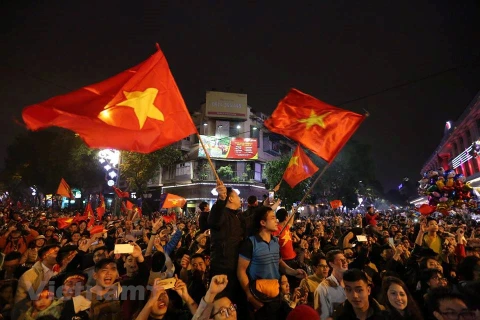 Người dân ăn mừng chiến thắng của U23 Việt Nam. (Ảnh: Minh Sơn/Vietnam+)