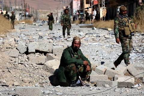 Lực lượng người Kurd và các chiến binh cộng đồng Yazidi. (Ảnh: AFP/TTXVN)
