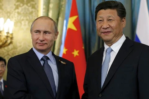 Tổng thống Nga Putin (trái) và Chủ tịch Trung Quốc Tập Cận Bình trong một cuộc gặp. (Nguồn: The Indian Express)