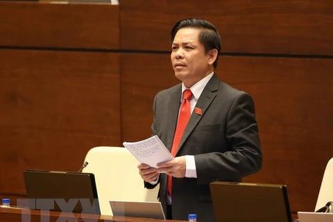 Bộ trưởng Bộ Giao thông Vận tải Nguyễn Văn Thể trả lời chất vấn. (Ảnh: Doãn Tấn/TTXVN)