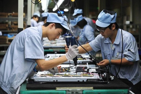 Công nhân tại một nhà máy ở Trung Quốc. (Nguồn: China 2 West)