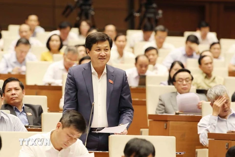 Tổng Thanh tra Chính phủ Lê Minh Khái trả lời chất vấn của Đại biểu Quốc hội. (Ảnh: Phương Hoa/TTXVN)