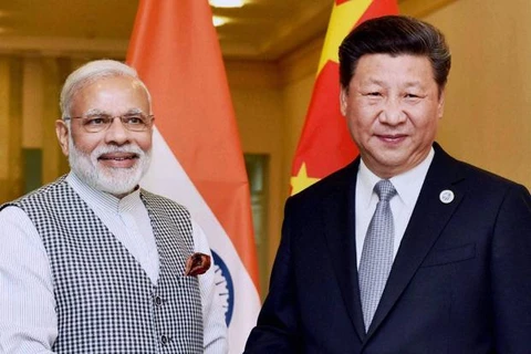 Chủ tịch Trung Quốc Tập Cận Bình (phải) và Thủ tướng Ấn Độ Narendra Modi. (Nguồn: Livemint)