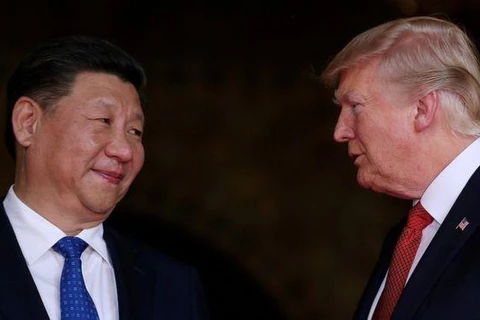 Tổng thống Mỹ Donald Trump (phải) và Chủ tịch Trung Quốc Tập Cận Bình. (Nguồn: Reuters)