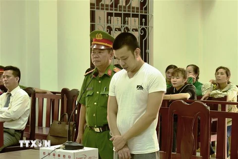 Bị cáo Lâm Trung Kiên nghe tuyên án. (Ảnh: Thanh Tân/TTXVN)
