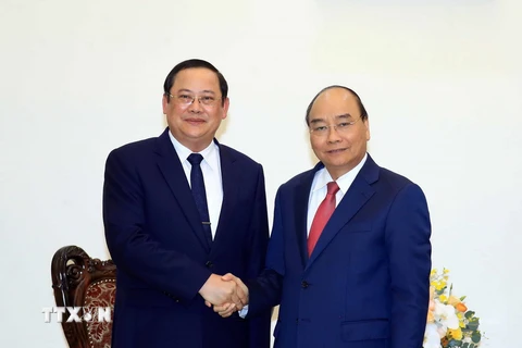 Thủ tướng Nguyễn Xuân Phúc tiếp Phó Thủ tướng kiêm Bộ trưởng Bộ Kế hoạch và Đầu tư Lào Sonsay Siphandone. (Ảnh: Thống Nhất/TTXVN)