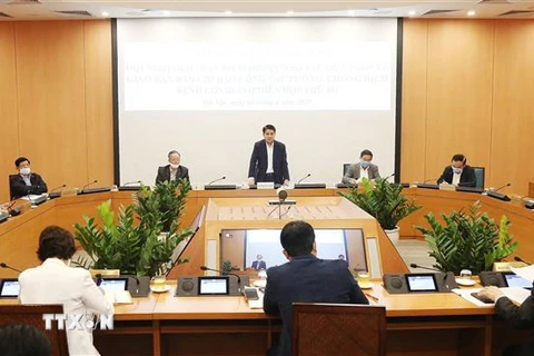 Chủ tịch Ủy ban Nhân dân thành phố Hà Nội Nguyễn Đức Chung chủ trì họp giao ban công tác quý 1 năm 2020. (Ảnh: Lâm Khánh/TTXVN)