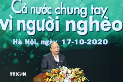 Thủ tướng Nguyễn Xuân Phúc phát biểu tại chương trình 'Cả nước chung tay vì người nghèo' năm 2020. (Ảnh: Doãn Tấn/TTXVN)