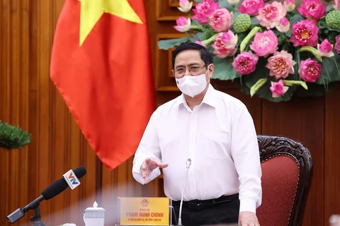 Thủ tướng Phạm Minh Chính yêu cầu thực hiện nghiêm túc các biện pháp phòng, chống dịch trong các khu công nghiệp. (Ảnh: Dương Giang/TTXVN)