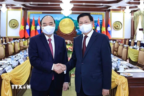 Chủ tịch nước Nguyễn Xuân Phúc và Tổng Bí thư, Chủ tịch nước Lào Thongloun Sisoulith tại buổi hội đàm. (Ảnh: Thống Nhất/TTXVN)