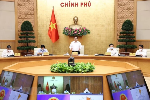 Thủ tướng Phạm Minh Chính chủ trì Phiên họp Chính phủ thường kỳ về tình hình phát triển kinh tế-xã hội tháng Tám và triển khai nhiệm vụ những tháng cuối năm 2021. (Ảnh: Dương Giang/TTXVN)