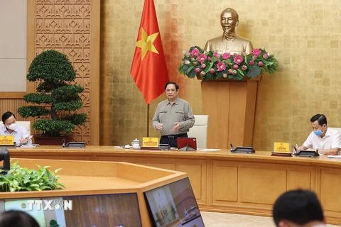Thủ tướng Phạm Minh Chính chủ trì họp Ban Chỉ đạo Quốc gia phòng, chống dịch COVID-19. (Ảnh: Dương Giang/TTXVN)