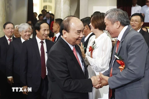 Chủ tịch nước Nguyễn Xuân Phúc dự Lễ tôn vinh và trao danh hiệu Nông dân Việt Nam xuất sắc năm 2022. (Ảnh: Thống Nhất/TTXVN)