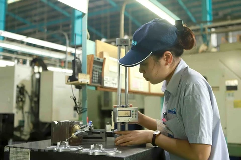 Công nhân tại khu công nghiệp Khai Quang, tỉnh Vĩnh Phúc. (Ảnh: Hoàng Hùng/TTXVN)