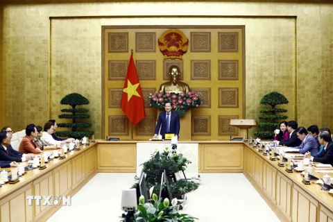 Phó Thủ tướng Lê Minh Khái phát biểu tại buổi gặp mặt. (Ảnh: An Đăng/TTXVN)