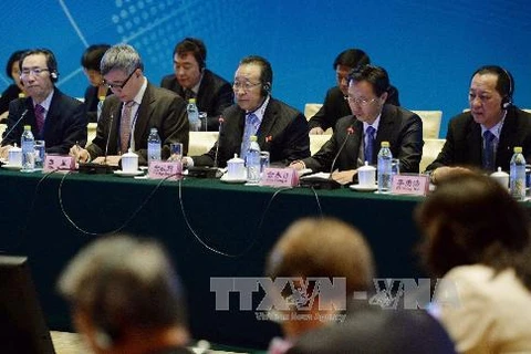 Thứ trưởng Ngoại giao Triều Tiên Kim Kye Gwan (giữa) tham dự hội thảo về đàm phán hạt nhân ở Trung Quốc (Nguồn: Kyodo-TTXVN)
