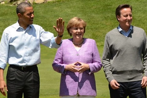 Tổng thống Mỹ Barack Obama (trái), Thủ tướng Đức Angela Merkel (giữa) và Thủ tướng Anh David Cameron (phải). (Nguồn: EPA)