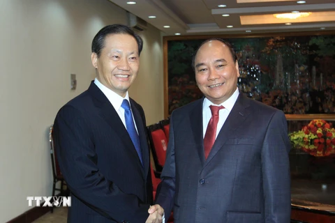 Phó Thủ tướng Nguyễn Xuân Phúc tiếp ông Bành Thanh Hoa. (Ảnh: An Đăng/TTXVN)
