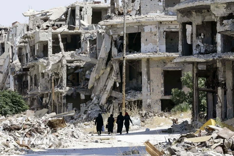Cảnh đổ nát do chiến sự ở thành phố Homs, miền trung Syria. (Nguồn: AFP/TTXVN)