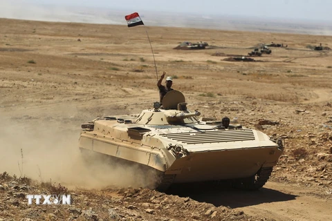  Các lực lượng Iraq tiến về thành phố Tal Afar, thành trì cuối cùng của IS tại Iraq, ngày 21/8. (Nguồn: AFP/TTXVN)