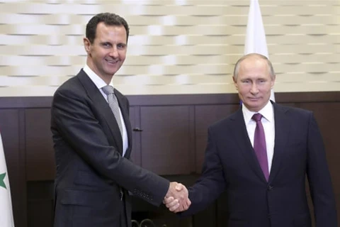 Tổng thống Nga Vladimir Putin (phải) trong cuộc gặp người đồng cấp Syria Bashar al-Assad. (Nguồn: Reuters)