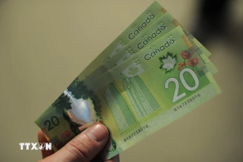  Đồng tiền mệnh giá 20 đôla Canada. (Nguồn: AFP/TTXVN)