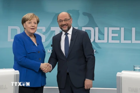 Thủ tướng Đức Angela Merkel (trái) và lãnh đạo đảng SPD Martin Schulz (phải). (Nguồn: AFP/TTXVN)